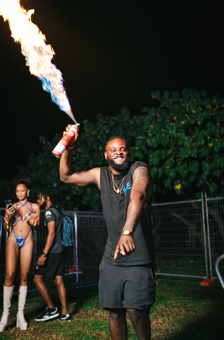 Partygoer with a flame spray